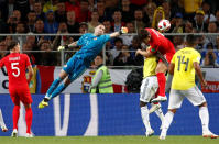 <p>Colombia’s David Ospina in action with England’s John Stones and Harry Maguire. REUTERS/Maxim Shemetov </p>