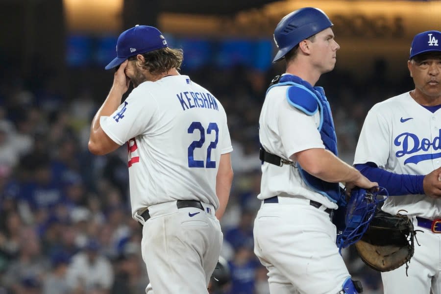 Los Angeles Dodgers starting pitcher Clayton Kershaw, left, reacts as he exits during the first inning in Game 1 of a baseball NL Division Series against the Arizona Diamondbacks, Saturday, Oct. 7, 2023, in Los Angeles. (AP Photo/Mark J. Terrill)