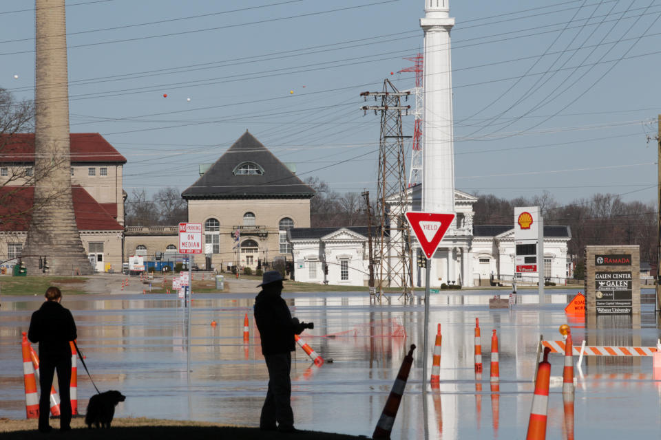 <p>Louisville residents watch the water after Ohio River flooded Louisville, Ky., Feb. 26, 2018. (Photo: John Sommers II/Reuters) </p>