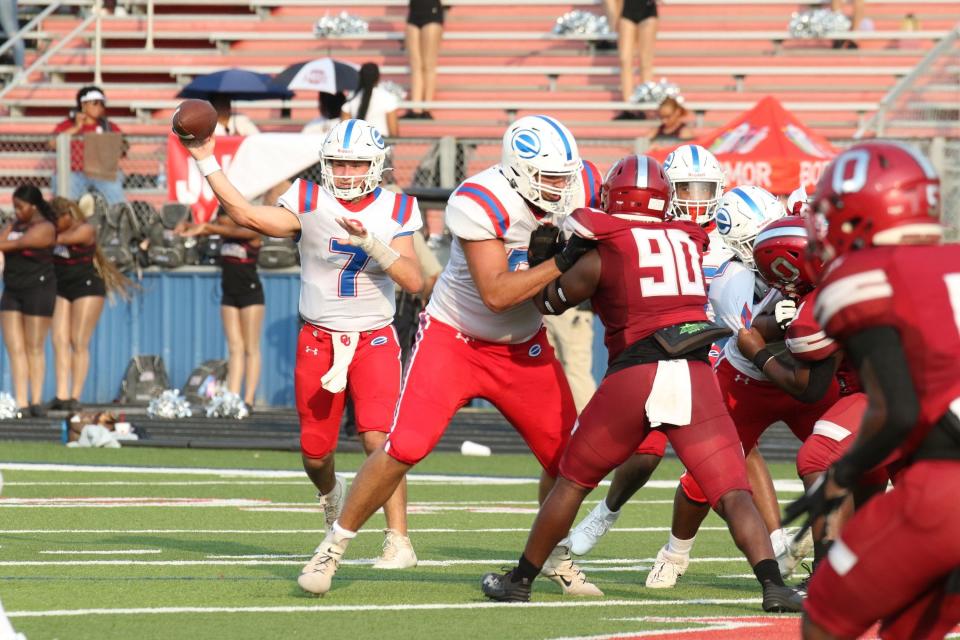 Evangel's Peyton Fulghum fires a pass against Ouachita Friday night in the Bayou Jamb at West Monroe High School. The Eagles out-scored the Lions 21-14 in the jamboree.