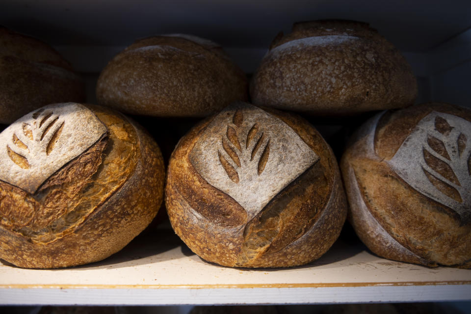 Freshly baked bread is displayed in Babushka Bakery in Budapest on Tuesday, April 11, 2023. Around the world, food prices are persistently, painfully high. Puzzlingly, too. On global markets, the price of grains, vegetable oil, dairy and other agricultural commodities has fallen steadily for months. (AP Photo/Denes Erdos)