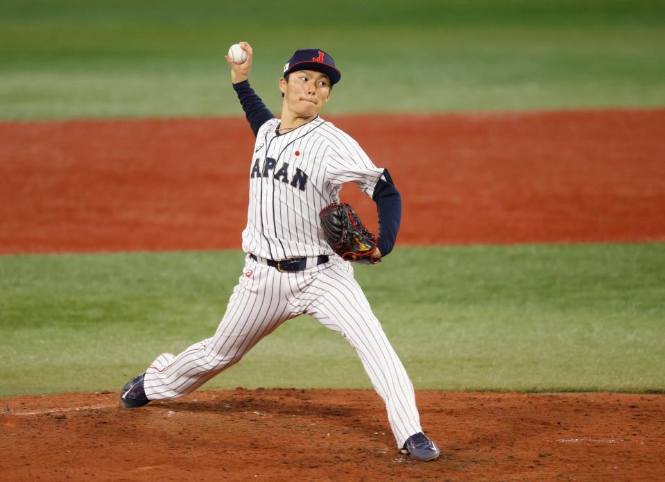 Japan pitcher Yoshinobu Yamamoto throws a pitch against Korea in a baseball semifinal match during the Tokyo 2020 Olympic Summer Games at Yokohama Baseball Stadium, Aug. 4, 2021 in Japan.