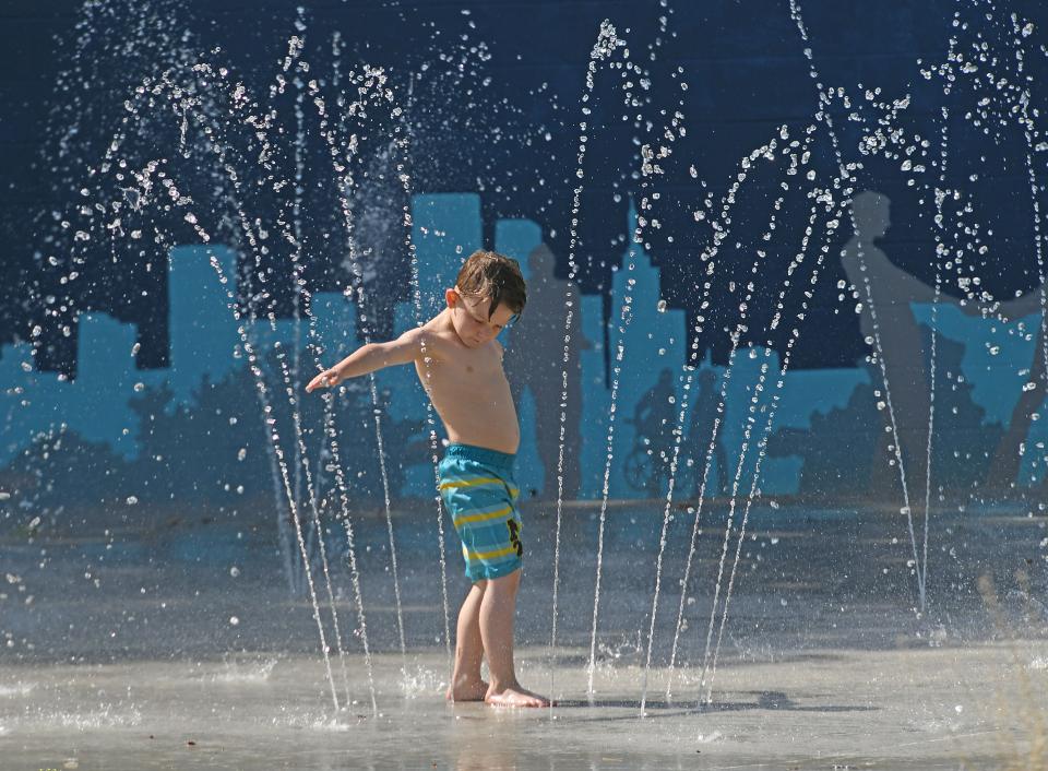 Daniel Stevens, 6 years old, enjoys the cool waters of the splash park in John's Park.