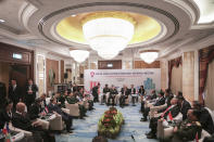 Chinese Defense Minister Wei Fenghe, center left, and Singapore Defense Minister Ng Eng Hen, center right, chair the ASEAN-China Defense Ministers' Informal Meeting during the 12th ASEAN Defense Ministers' Meeting in Singapore Friday, Oct. 19, 2018. (AP Photo/Don Wong)