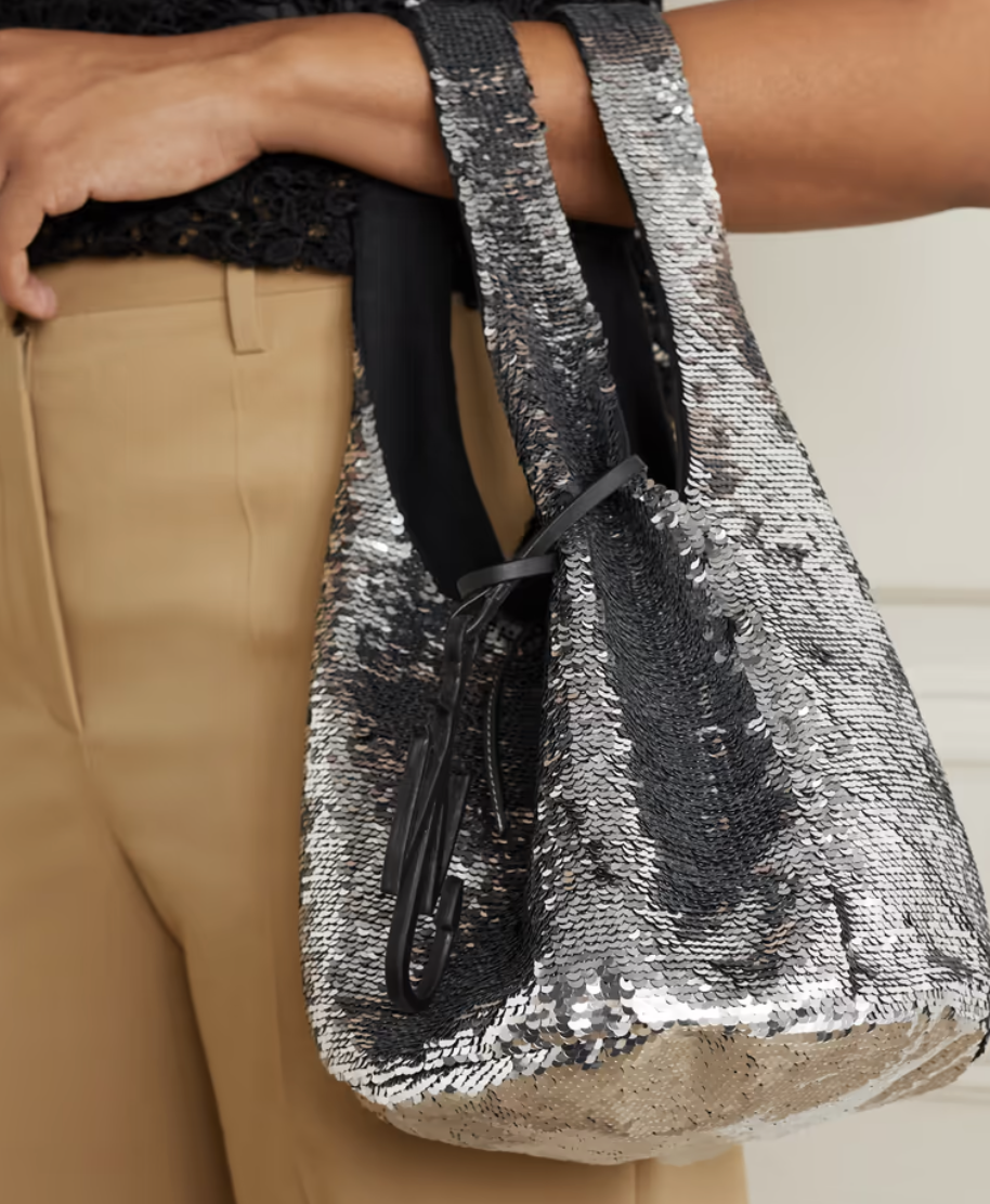 A photo of JW Anderson Mini leather-trimmed sequined jersey tote.
