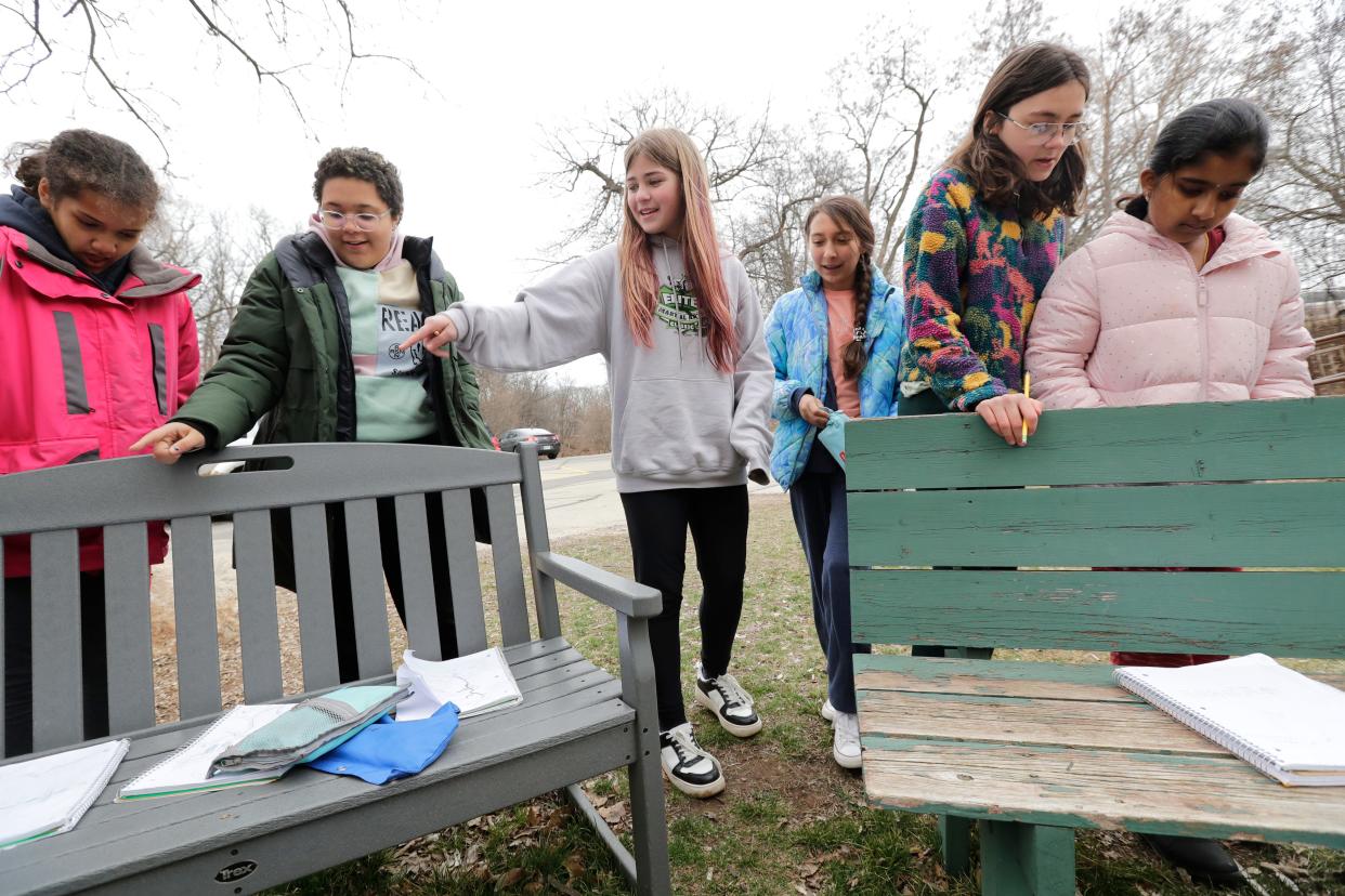 Students gather to share the observations they recorded in their nature journals during an observation activity March 14 at Pierce Park in Appleton. During these activities, Joann Casper's sixth-, seventh- and eighth-grade Fox River Academy students look for similarities and differences in things they see around them in nature.