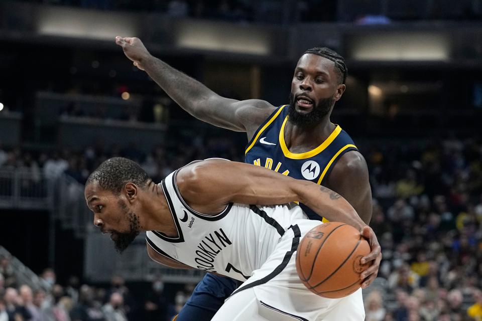 Brooklyn Nets' Kevin Durant (7) is defended by Indiana Pacers' Lance Stephenson during the first half of an NBA basketball game Wednesday, Jan. 5, 2022, in Indianapolis.