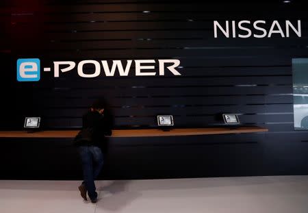 A visitor pauses at Nissan Motor booth during media preview of the 45th Tokyo Motor Show in Tokyo, Japan October 25, 2017. REUTERS/Kim Kyung-Hoon