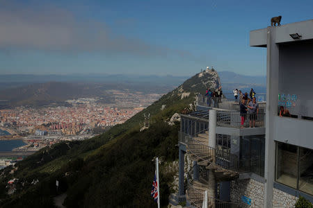 Tourists stand at a terrace on the top of the Rock in the British overseas territory of Gibraltar, historically claimed by Spain, March 29, 2017. REUTERS/Jon Nazca