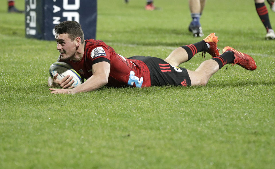 Crusaders Will Jordan scores his team's match winning try during the Super Rugby Aotearoa rugby game between the Crusaders and the Blues in Christchurch, New Zealand, Saturday, July 11, 2020. (AP Photo/Mark Baker)