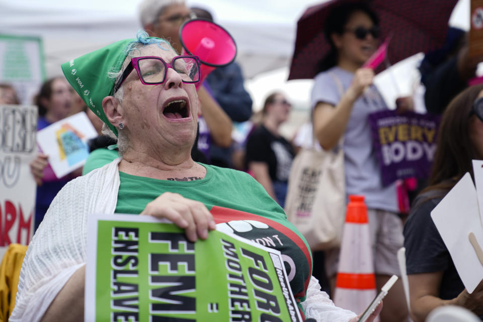 Abortion rights demonstrators hold signs as they gather for the Women's March in Washington, Saturday, June 24, 2023. Abortion rights and anti-abortion activists held rallies Saturday in Washington and across the country to call attention to the Dobbs v. Jackson Women’s Health Organization ruling on June 24, 2022, which upended the 1973 Roe v. Wade decision. (AP Photo/Stephanie Scarbrough)