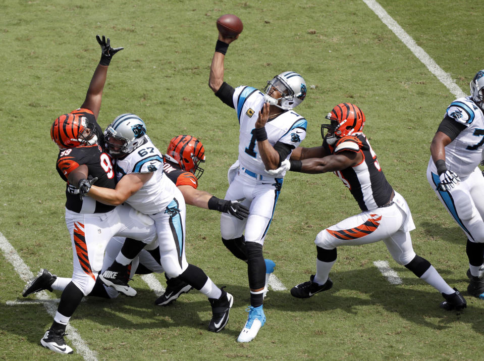 Carolina Panthers' Cam Newton (1) looks to pass against the Cincinnati Bengals during the first half of an NFL football game in Charlotte, N.C., Sunday, Sept. 23, 2018. (AP Photo/Bob Leverone)