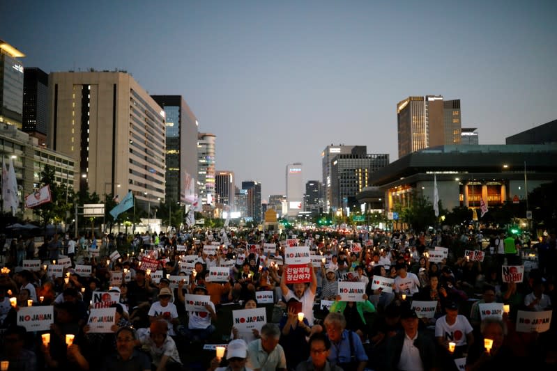 South Korean people chant slogans during an anti-Japan rally in Seoul