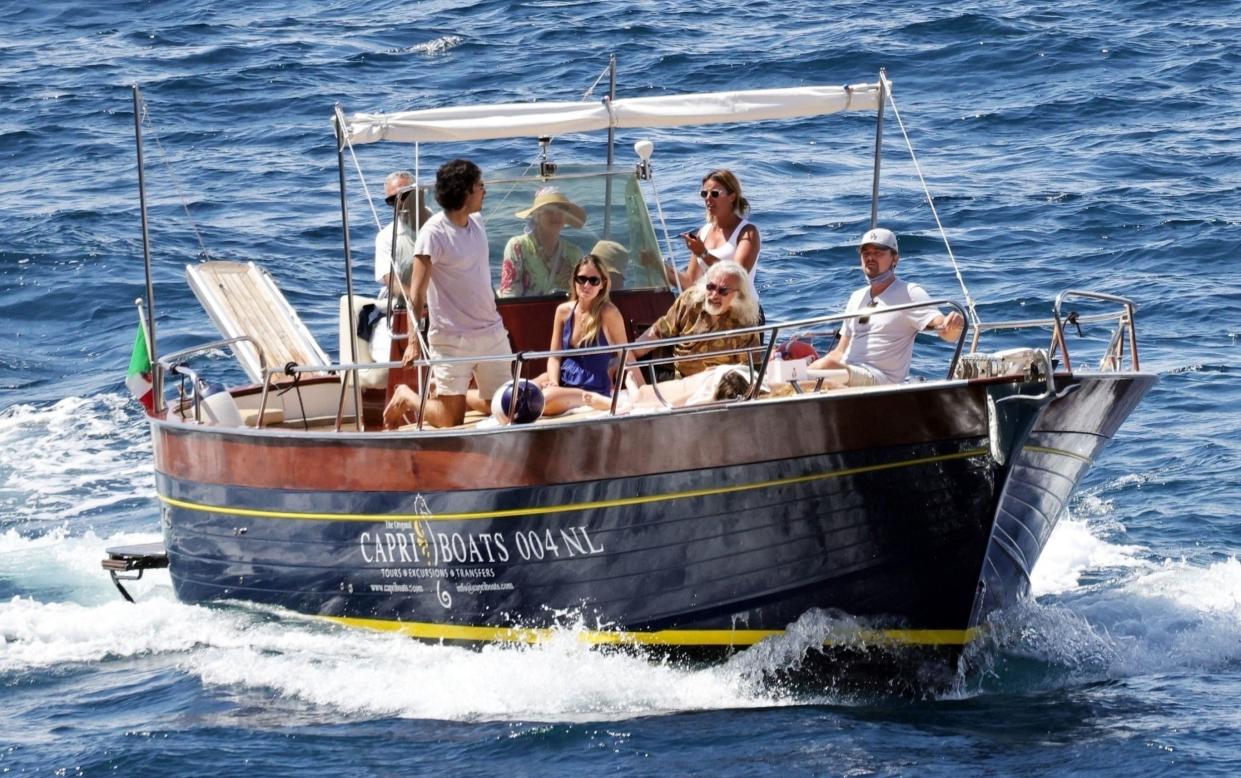 Leonardo DiCaprio pictured on a boat with his father George, niece Normandie DiCaprio and stepmother Peggy Farrar