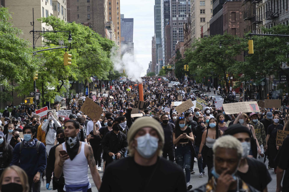 Protesters march through midtown New York as part of a demonstration Tuesday, June 2, 2020, in New York, to protest the death of George Floyd, who died May 25 after he was pinned at the neck by a Minneapolis police officer. (AP Photo/Yuki Iwamura)