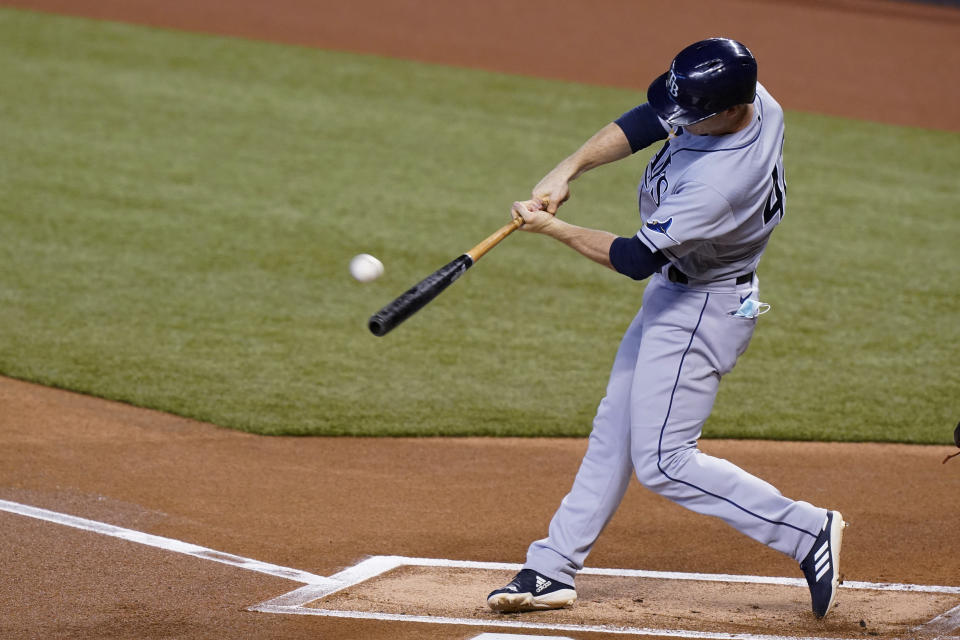 Tampa Bay Rays' Joey Wendle hits a home run during the first inning of a baseball game against the Miami Marlins, Sunday, Aug. 30, 2020, in Miami. (AP Photo/Wilfredo Lee)