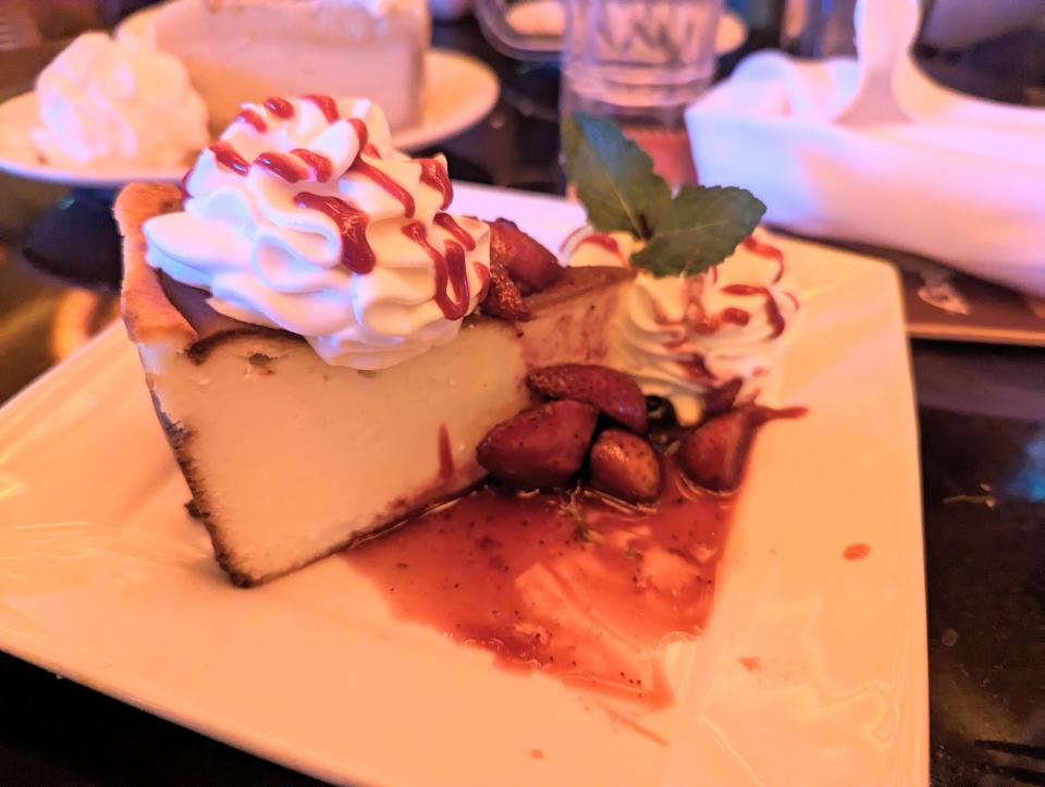 Basque cheesecake on plate with strawberries at the cheesecake factory