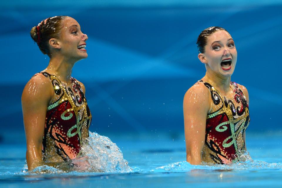 Britain's Jenna Randall and Britain's Olivia Federici compete in the duets technical routine during the synchronised swimming competition at the London 2012 Olympic Games on August 5, 2012 in London. AFP PHOTO / MARTIN BUREAUMARTIN BUREAU/AFP/GettyImages