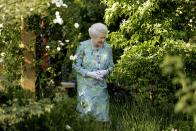 <p>Queen Elizabeth II wanders through one of the gardens at the Chelsea Flower Show in 2010. Typically, the Queen always visited on Press Day in the late afternoon.</p>