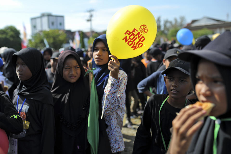 Children queue up for their turn to be vaccinated against poliovirus during a polio immunization campaign at Sigli Town Square in Pidie, Aceh province, Indonesia, Monday, Nov. 28, 2022. Indonesia has begun a campaign against the poliovirus in the the country's conservative province after several children were found infected with the highly-contagious disease that was declared eradicated in the country less than a decade ago. (AP Photo/Riska Munawarah)