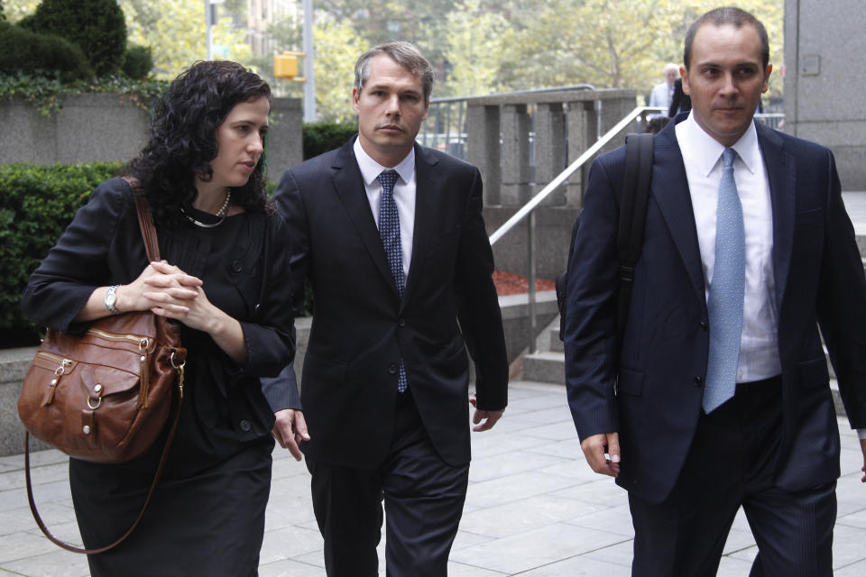 Shepard Fairey, center, leaves Manhattan Federal court in New York with his attorneys, Dan Gitner, right, and Abigail Rosen, Friday, Sept. 7, 2012. Fairey, who created the "HOPE" poster that came to symbolize Barack Obama's 2008 presidential campaign, was sentenced Friday to two years of probation and 300 hours of community service for destroying and fabricating documents in a civil lawsuit pertaining to The Associated Press photograph he relied upon to make the poster. (AP Photo/Mary Altaffer)