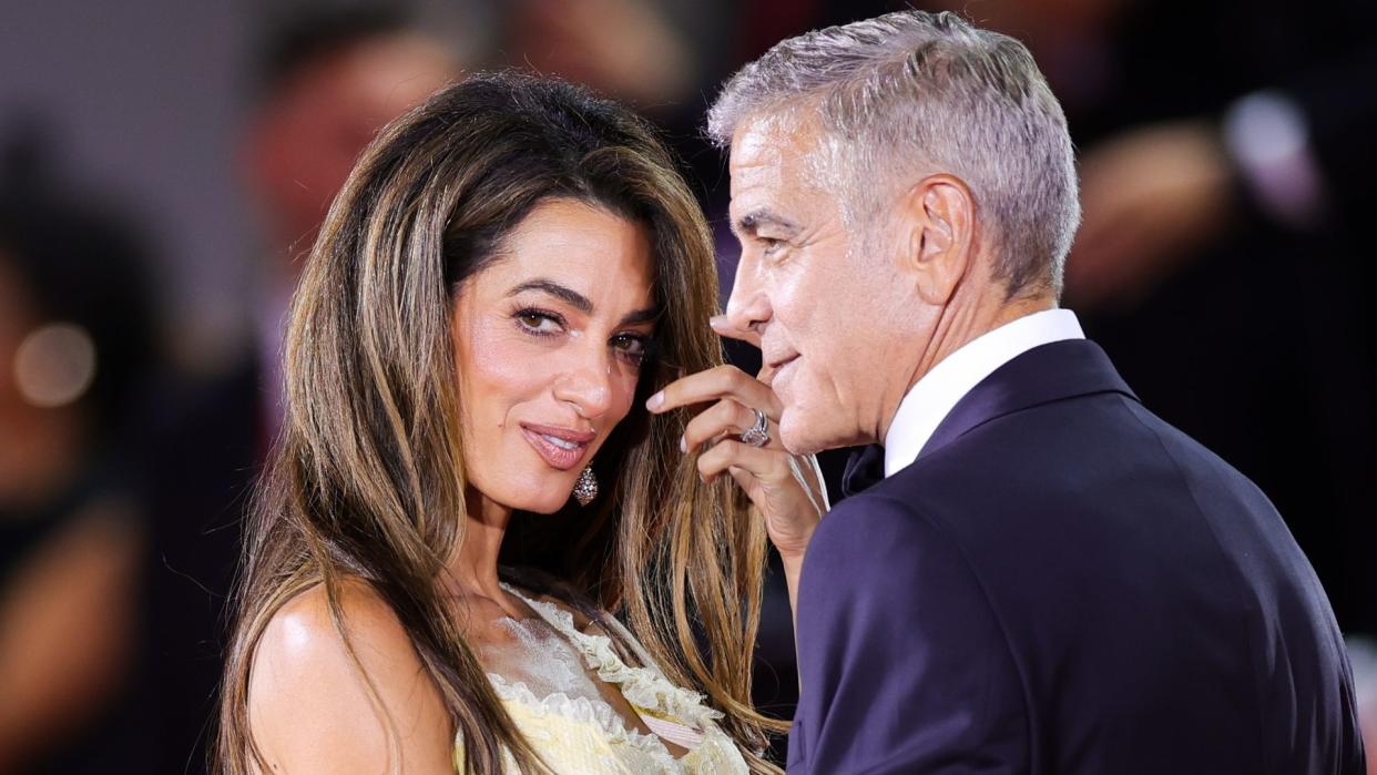 Amal Clooney and George Clooney attends the 