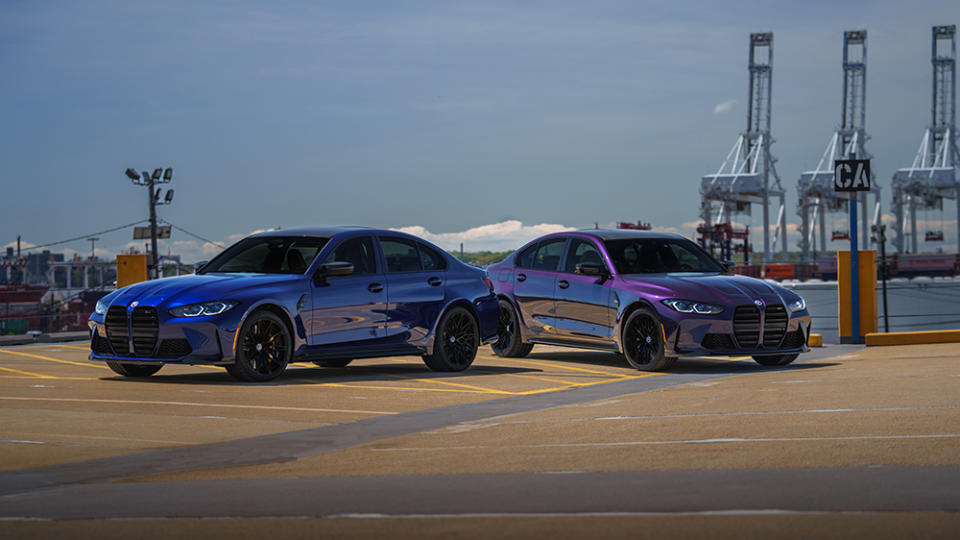 The 2023 The M3 Edition 50 Jahre BMW M in Deep Interlagos Blue (left) in front of another example in Techno Violet (right) - Credit: BMW