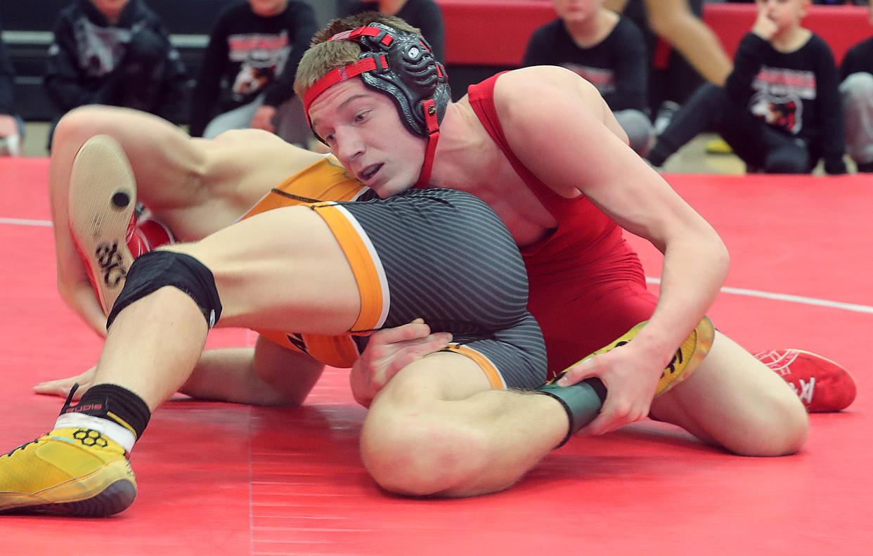 Jaxon Joy, right, and the Wadsworth wrestling team qualified for the Division I State Duals with a win over Perry on Saturday.