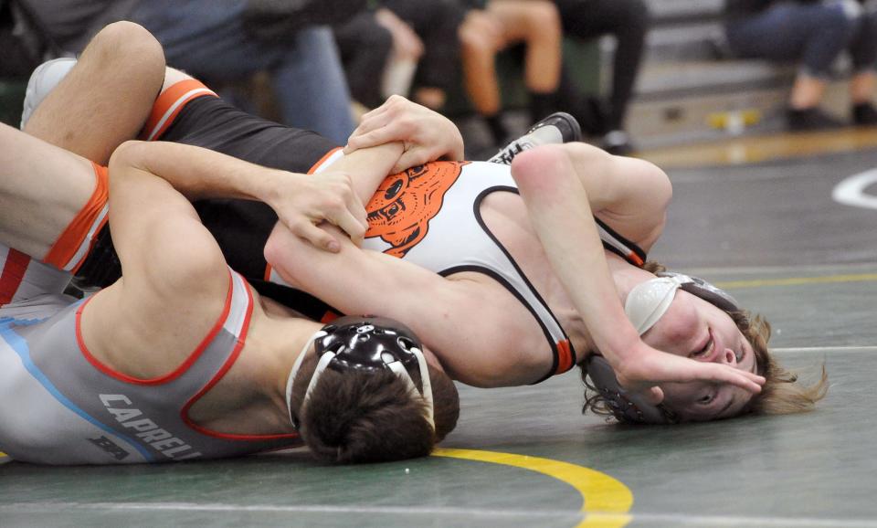 Dalton's Micah Boyer is pinned in the 126-pound final by Lima Central Catholic's Gavin Caprella.