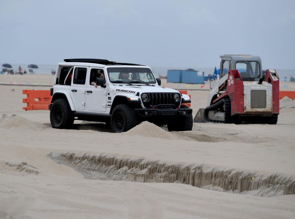 Jeeps take to the beach at the Kicker and The Metal Shop Sand Course at Jeep Week Thursday, Aug. 24, 2023, in front of Somerset Plaza in Ocean City, Maryland.
