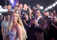 <p>Alex Rodriguez being a dutiful ‘Instagram husband’ for girlfriend Jennifer Lopez at the VMAs. (Reuters) </p>