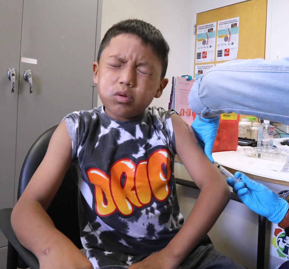 Maykel Cajamarca gets his shots for school at the Rockland County Department of Health satellite vaccination clinic in Spring Valley Oct. 19, 2023.