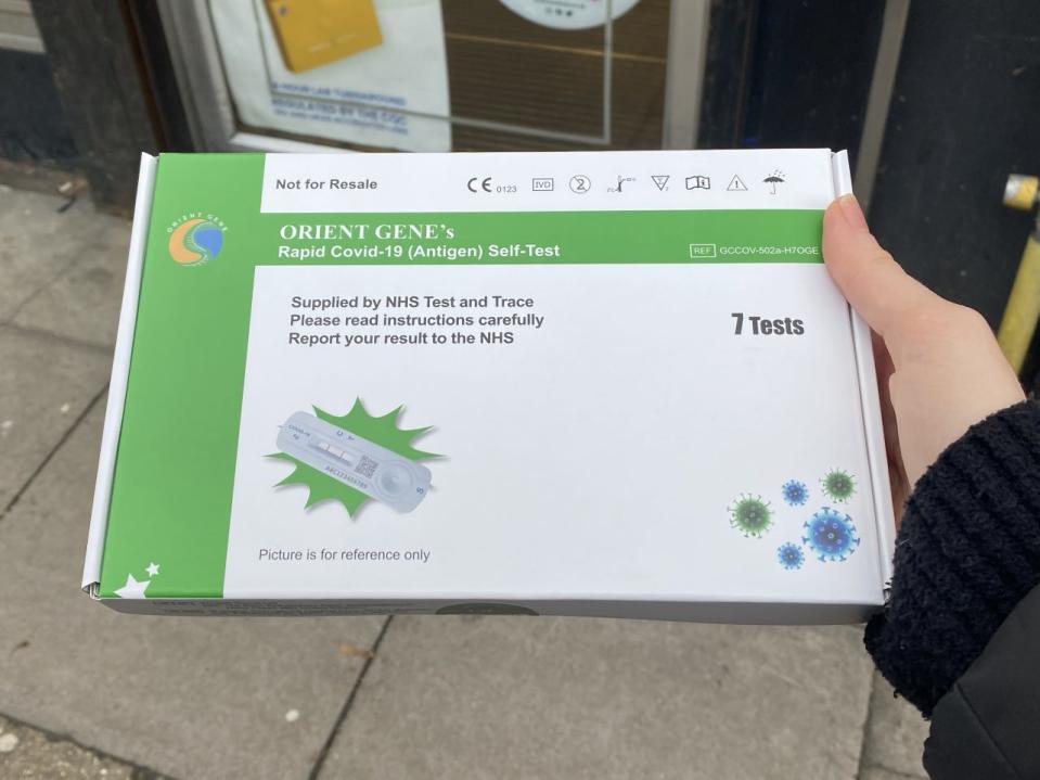 Picking up rapid tests from a pharmacy in London, using a collect code.