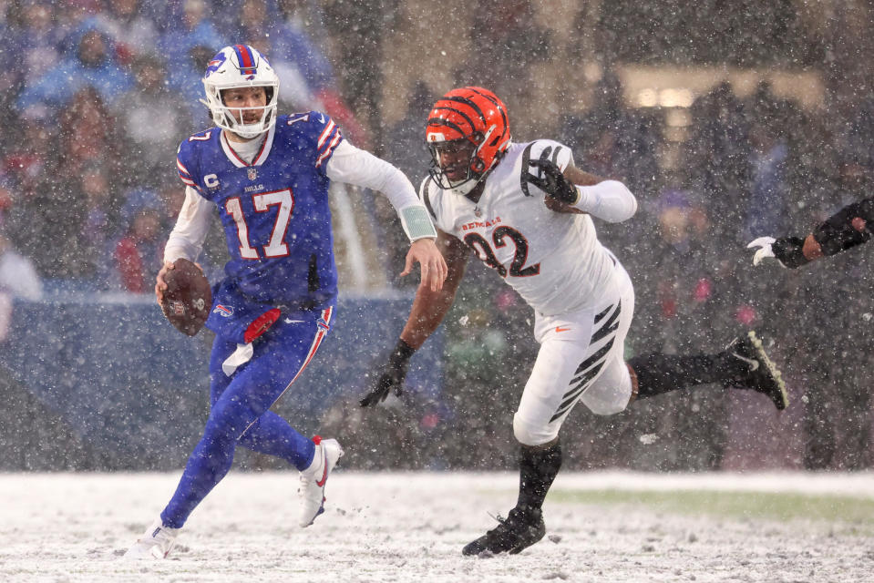 ORCHARD PARK, NEW YORK - JANUARY 22: Josh Allen #17 of the Buffalo Bills looks to pass against the Cincinnati Bengals during the second half in the AFC Divisional Playoff game at Highmark Stadium on January 22, 2023 in Orchard Park, New York. (Photo by Bryan M. Bennett/Getty Images)