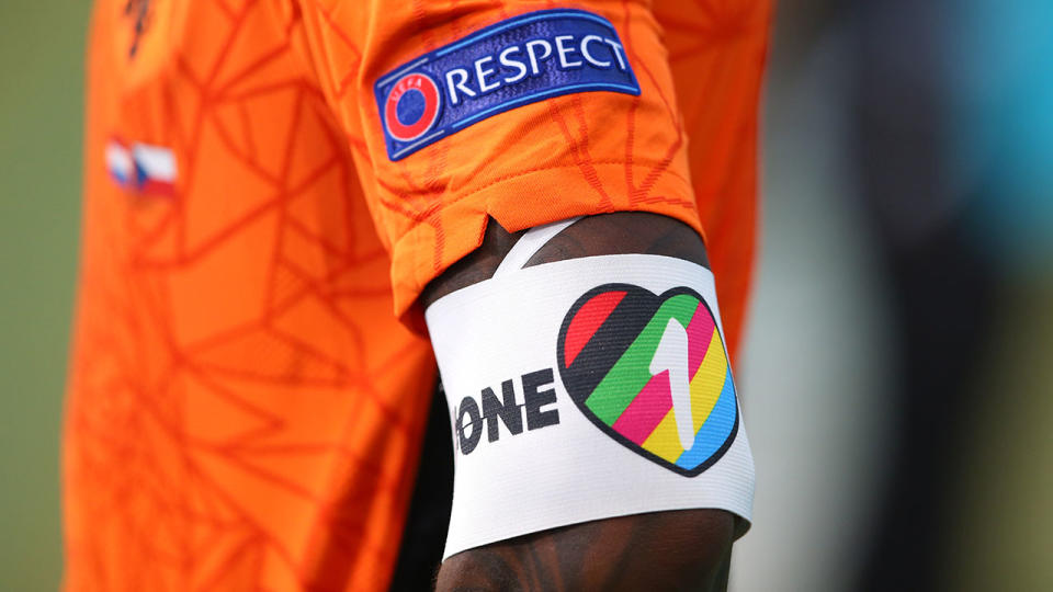 The 'One Love' armband is seen being work by a player.