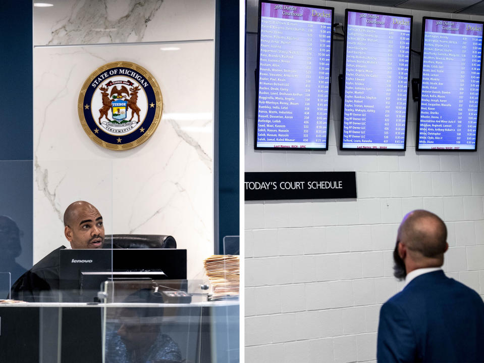 Judge Adam Sabree holds housing court, and a man checks a schedule, in the 36th District Court in Detroit on June 5, 2023. (Sarah Rice for NBC News)