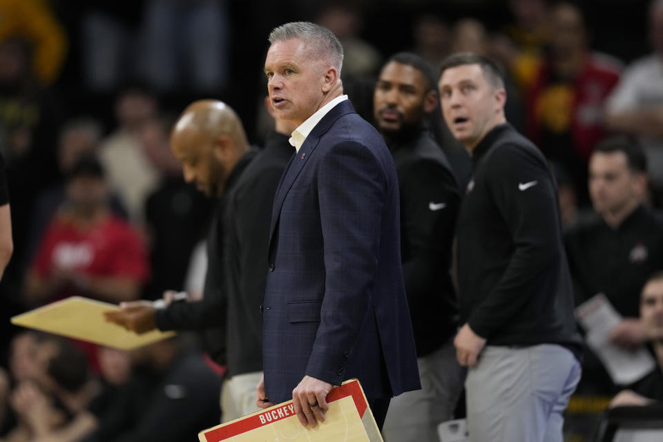 Ohio State head coach Chris Holtmann watchers from the bench during the second half of an NCAA college basketball game against Iowa, Friday, Feb. 2, 2024, in Iowa City, Iowa. Iowa won 79-77. (AP Photo/Charlie Neibergall)