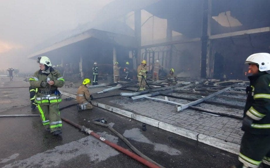 Firefighters at the scene of the attack - State Emergency Service of Ukraine/Shutterstock