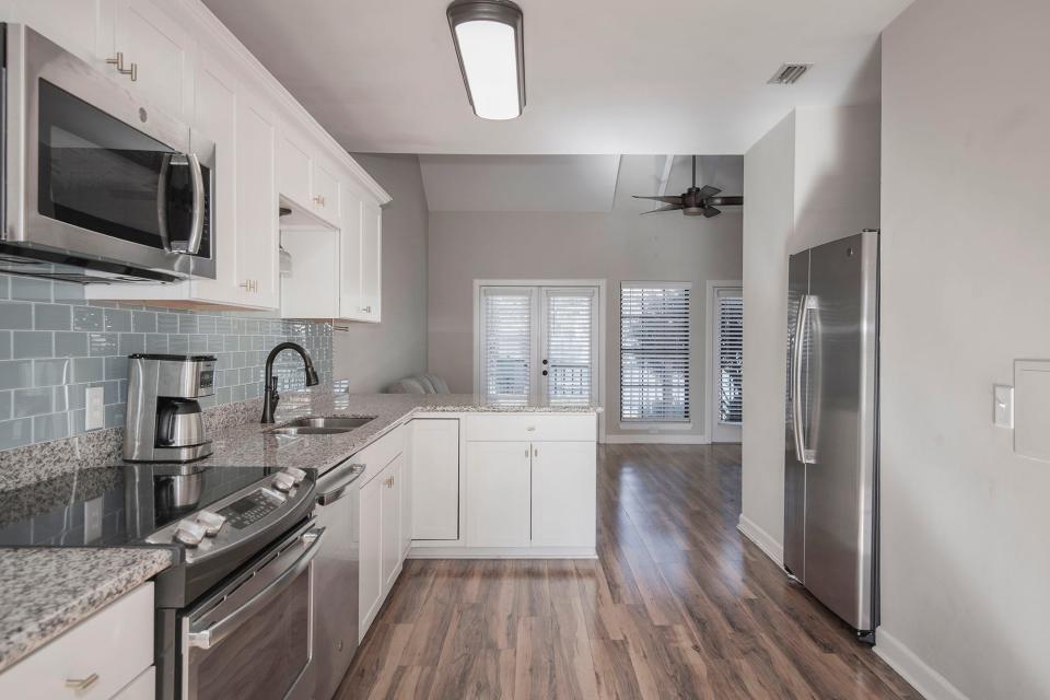 The kitchen includes stainless appliances.