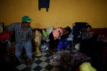 Eufemia Garcia, 48, who lost 50 members of her family during the eruption of the Fuego volcano, rests at a shelter after a long day searching for her family in Escuintla, Guatemala, June 14, 2018. REUTERS/Carlos Jasso