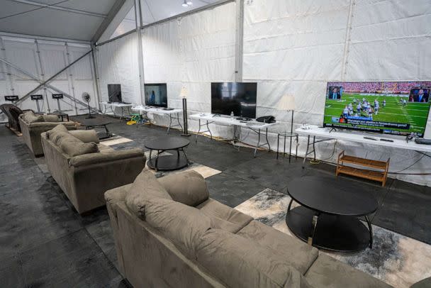 PHOTO: A TV watching lounge for temporarily housed migrants at the Humanitarian Emergency Response and Relief Center, which is designed to process and temporarily house migrants on Randall's Island in New York City, Oct. 18, 2022. (David 