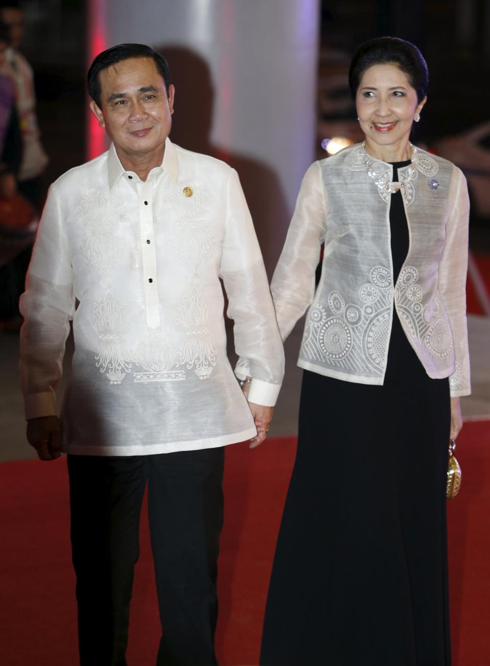 Thailand's Prime Minister Prayut Chan-ocha and his wife Naraporn arrive for a welcome dinner during the Asia-Pacific Economic Cooperation (APEC) summit in the capital city of Manila, Philippines