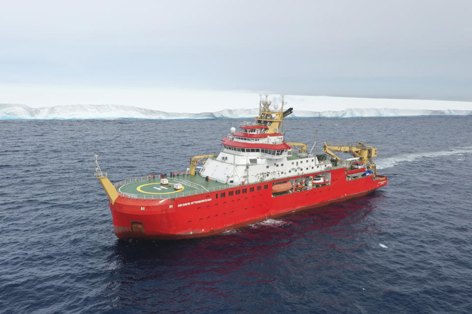 In this handout photo provided by the British Antarctic Survey, the RRS Sir David Attenborough in front of A23a iceberg in Antarctica, Friday, Dec. 1, 2023. Britain's polar research ship has crossed paths with the largest iceberg in the world in a “lucky” encounter that enabled scientists to collect seawater samples around the colossal berg as it drifts out of Antarctic waters. The British Antarctic Survey said Monday, Dec. 4 that the RRS Sir David Attenborough passed the mega iceberg, known as the A23a, on Friday near the tip of the Antarctic Peninsula. (T.Gossman, M.Gascoyne, C.Grey/British Antarctic Survey via AP)