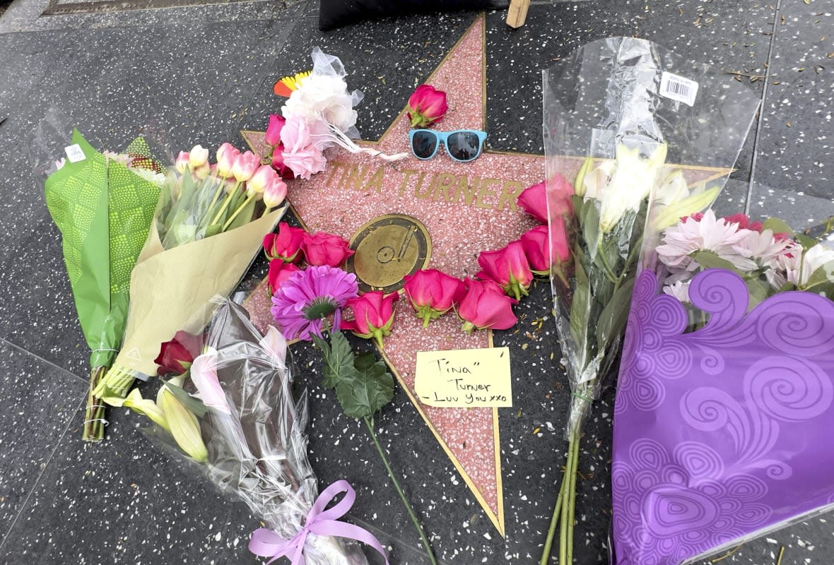 Flowers and tributes appear on Tina Turner’s star on the Hollywood Walk of Fame on Wednesday, May 24, 2023, in Los Angeles. Turner, the unstoppable singer and stage performer with hits like “What’s Love Got to Do With It,” died Tuesday after a long illness at her home in Küsnacht near Zurich, Switzerland, according to her manager. She was 83. (AP Photo/Rick Taber)