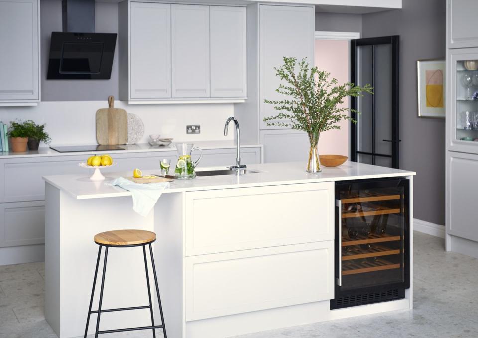 <p>Keeping your white kitchen clean and streamlined means some clever design features. Opt for sleek, handleless cabinets, an undermount sink, and integrated features such as this understated wine fridge. </p><p>Pictured: <a href="https://www.housebeautiful.com/uk/house-beautiful-collections/a35137588/homebase-kitchen-storage-house-beautiful/" rel="nofollow noopener" target="_blank" data-ylk="slk:House Beautiful Westbourne Kitchen at Homebase;elm:context_link;itc:0;sec:content-canvas" class="link ">House Beautiful Westbourne Kitchen at Homebase</a></p>