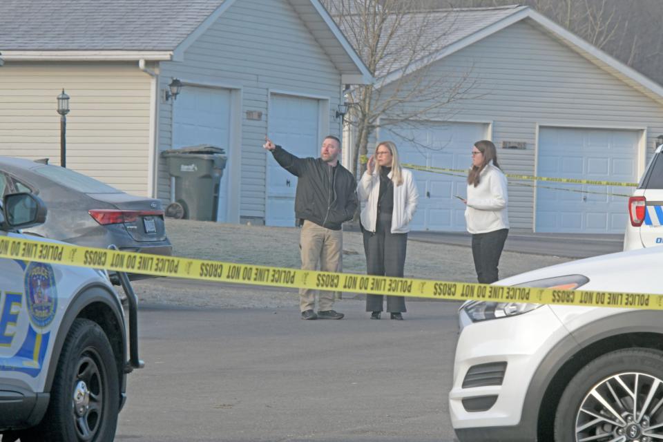 Law enforcement investigate a crime scene at 1019 Landings Court after multiple shootings and a standoff occurred, including a hostage, that took place Sunday night.