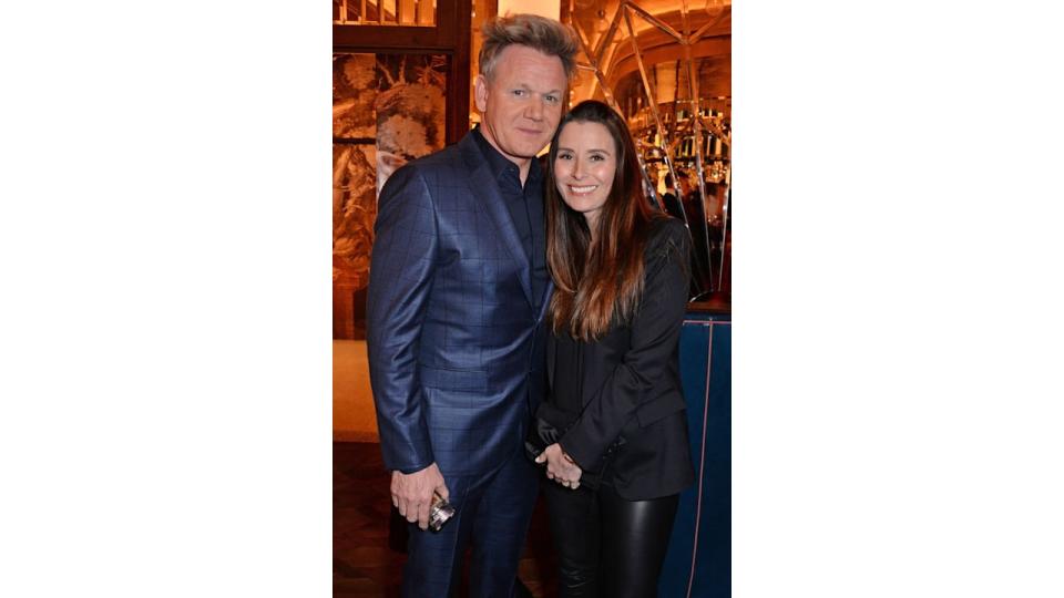 gordon ramsay in blue suit with wife tana smiling 