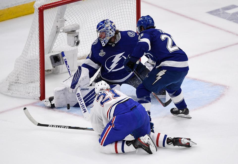 Tampa Bay Lightning goaltender Andrei Vasilevskiy makes a save against Montreal Canadiens center Eric Staal.
