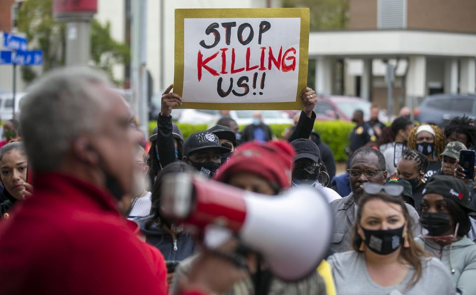 Kirk Rivers addresses demonstrators outside City Hall as they await members of the city council who held an emergency meeting on Friday, April 23, 2021, in Elizabeth City, N.C., in regards to the death of Andrew Brown Jr., who was shot and killed by a Pasquotank County Deputy Sheriff earlier in the week. (Robert Willett/The News & Observer via AP)