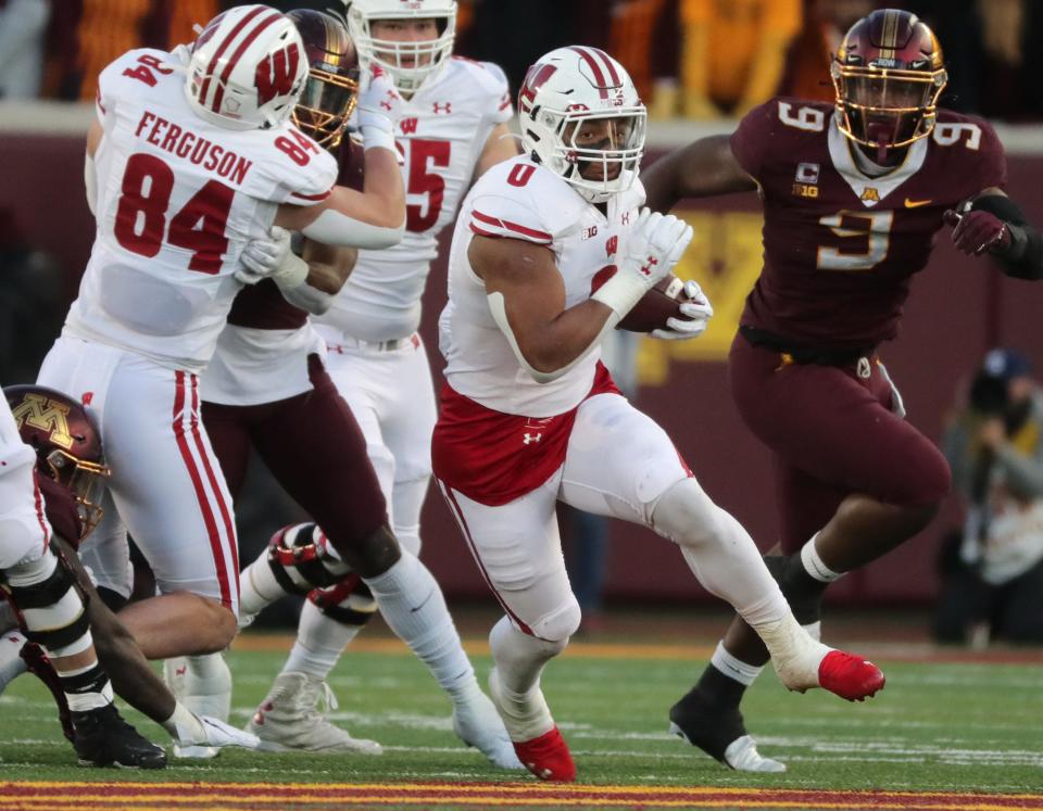 Wisconsin running back Braelon Allen (0) finds an opening during the second quarter of their game on Nov. 27. Allen burst onto the scene as a freshman, rushing for 1,109 yards and 12 touchdowns.